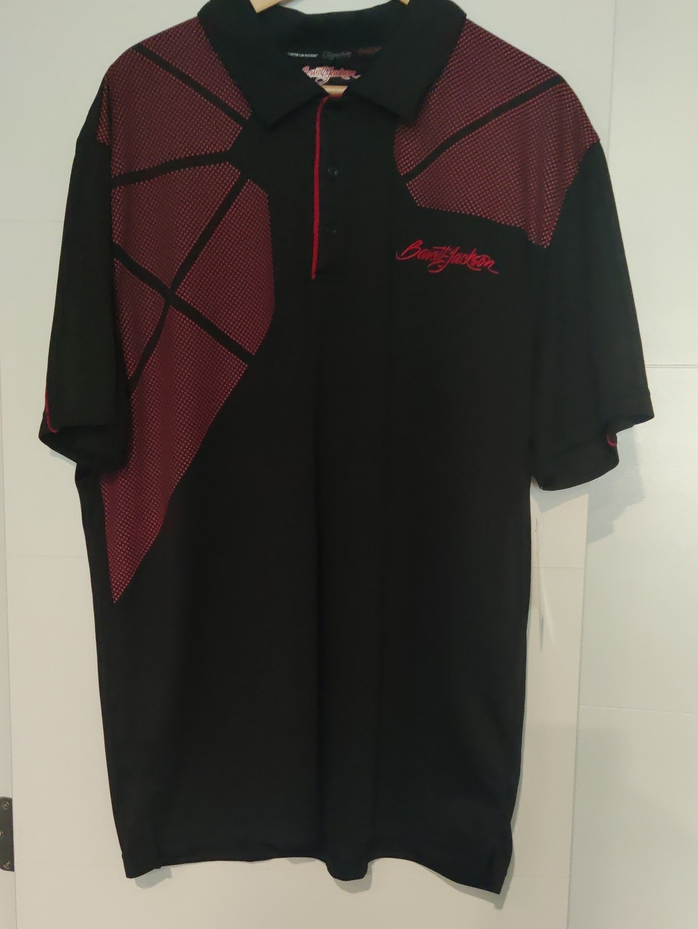 Black & Red Barrett-Jackson Performance Polo features a Geometric Dot Pattern
